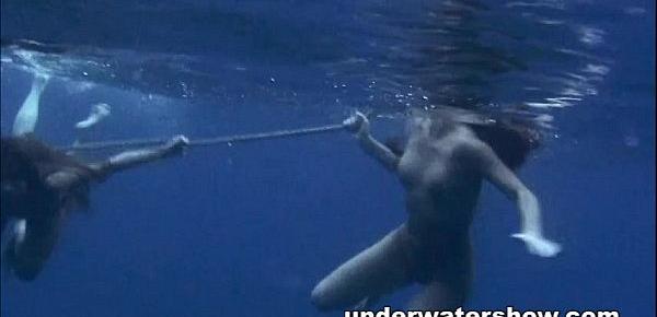  Three girls swimming nude in the sea